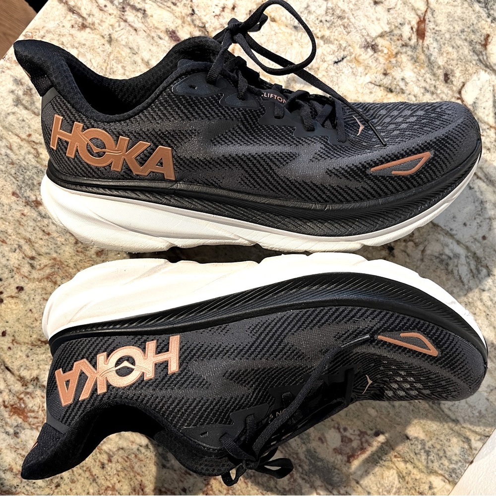 Women’s HOKA Running Walking sneakers size 12 Clifton 9 Black and bronze trim